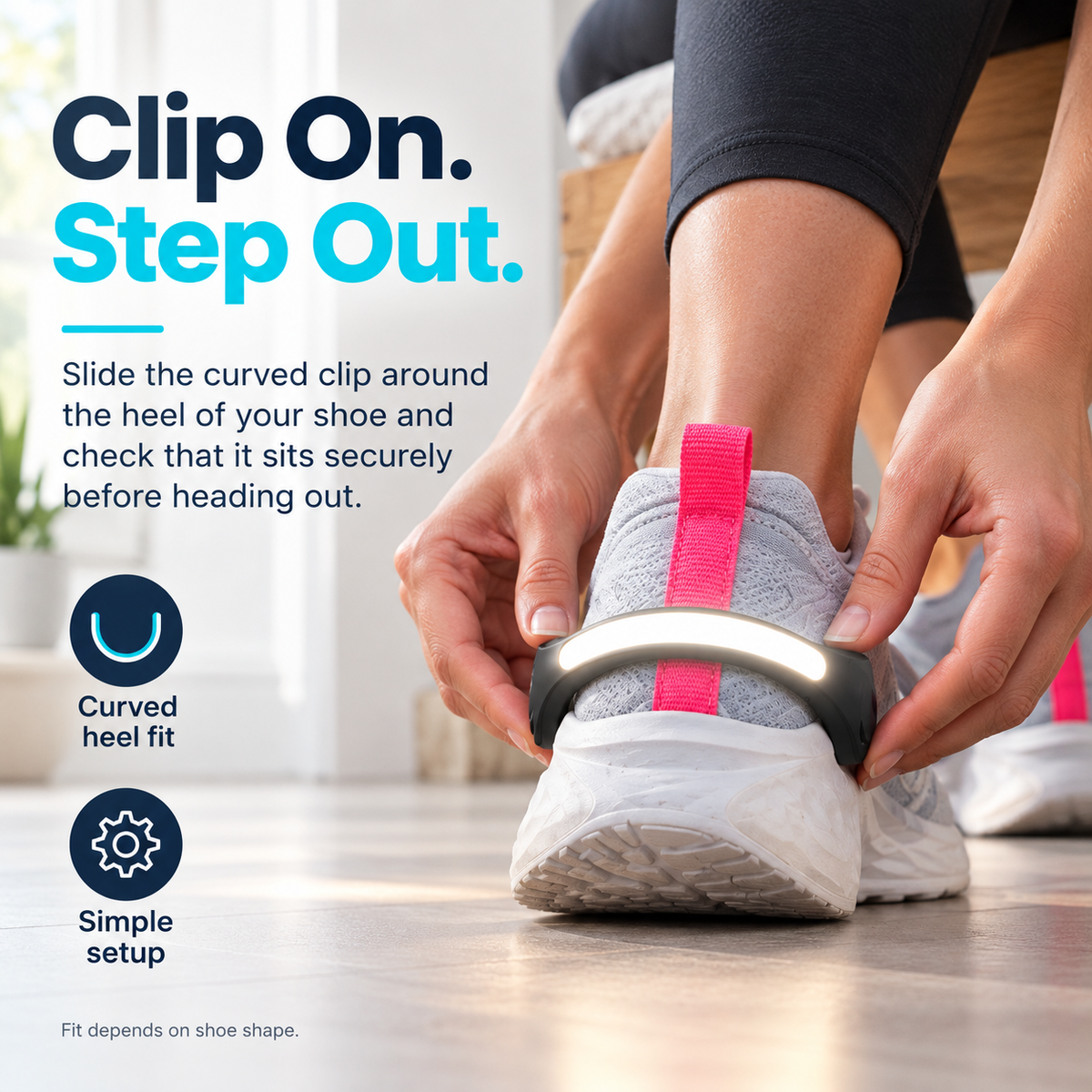 Hands attaching the curved LED shoe light clip around the heel of a sneaker