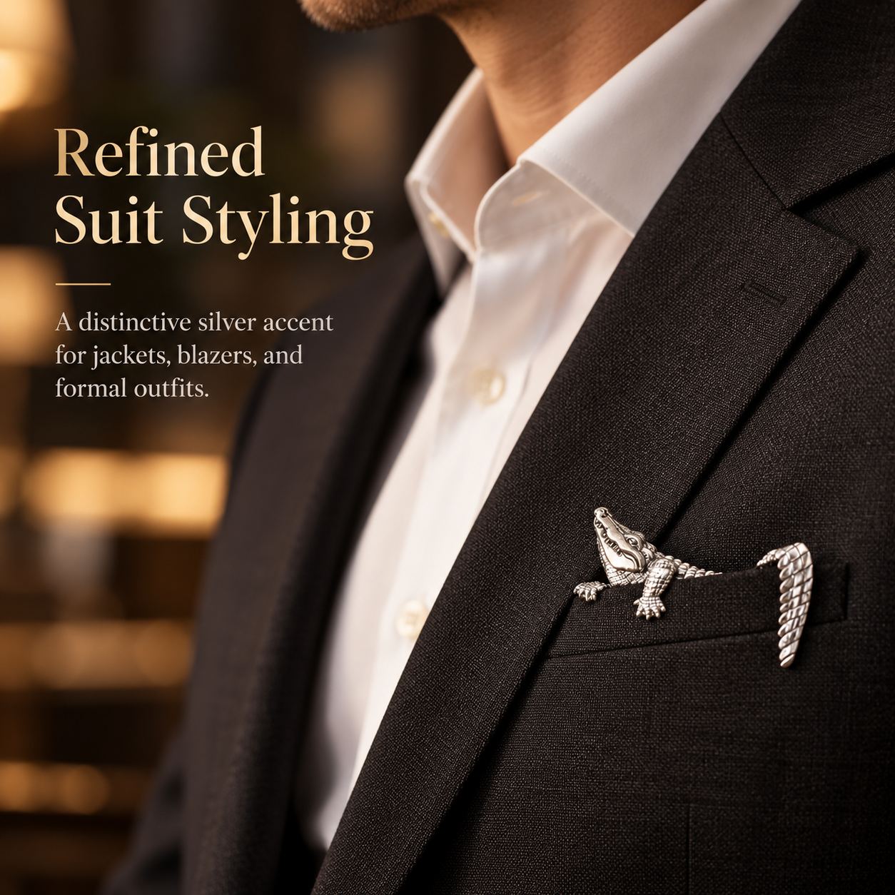 Silver-tone crocodile accessory styled on a dark suit jacket