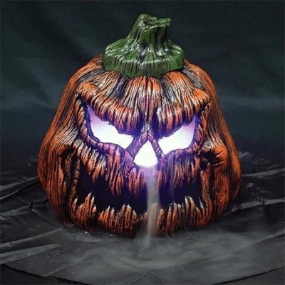 Halloween pumpkin prop with illuminated fog effect emerging from carved face