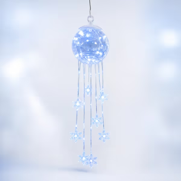 Illuminated blue snowflake hanging ornament on a light background