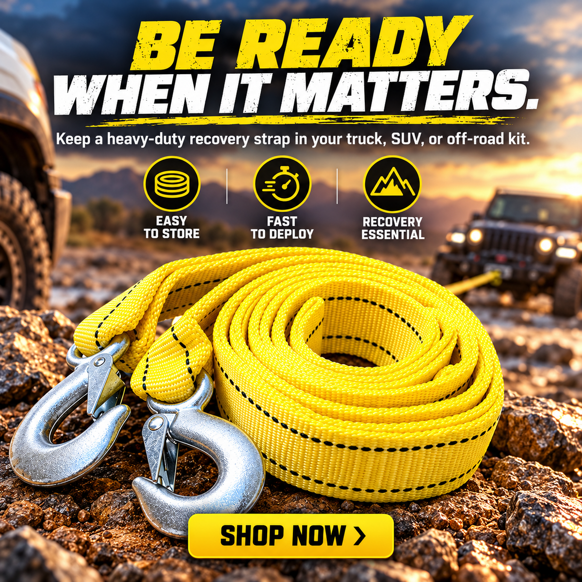 Coiled high-visibility yellow tow strap with two metal hooks displayed as part of an off-road vehicle recovery kit