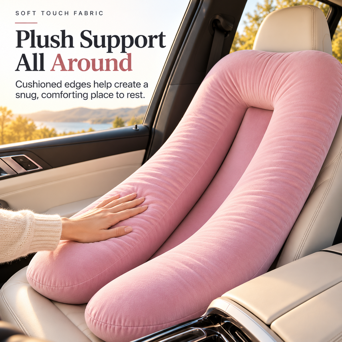 Close-up view of the plush-looking pink surface and cushioned edges of the full-body car seat pillow