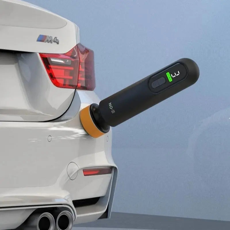 Cordless mini car polisher working on rear bumper paint