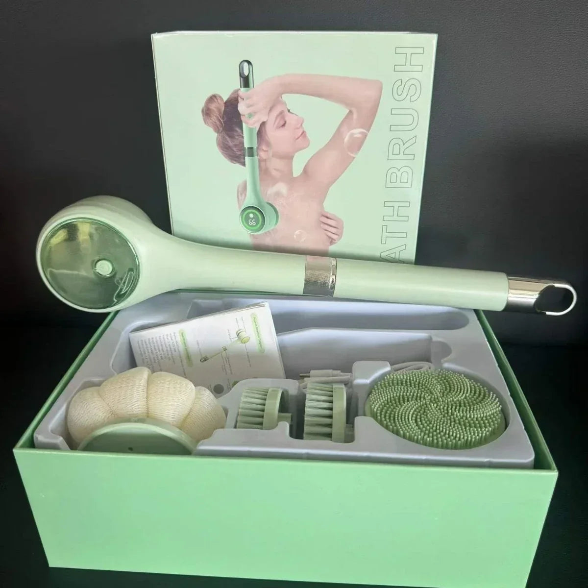 Electric body scrubber set in package with long handle and interchangeable brush heads