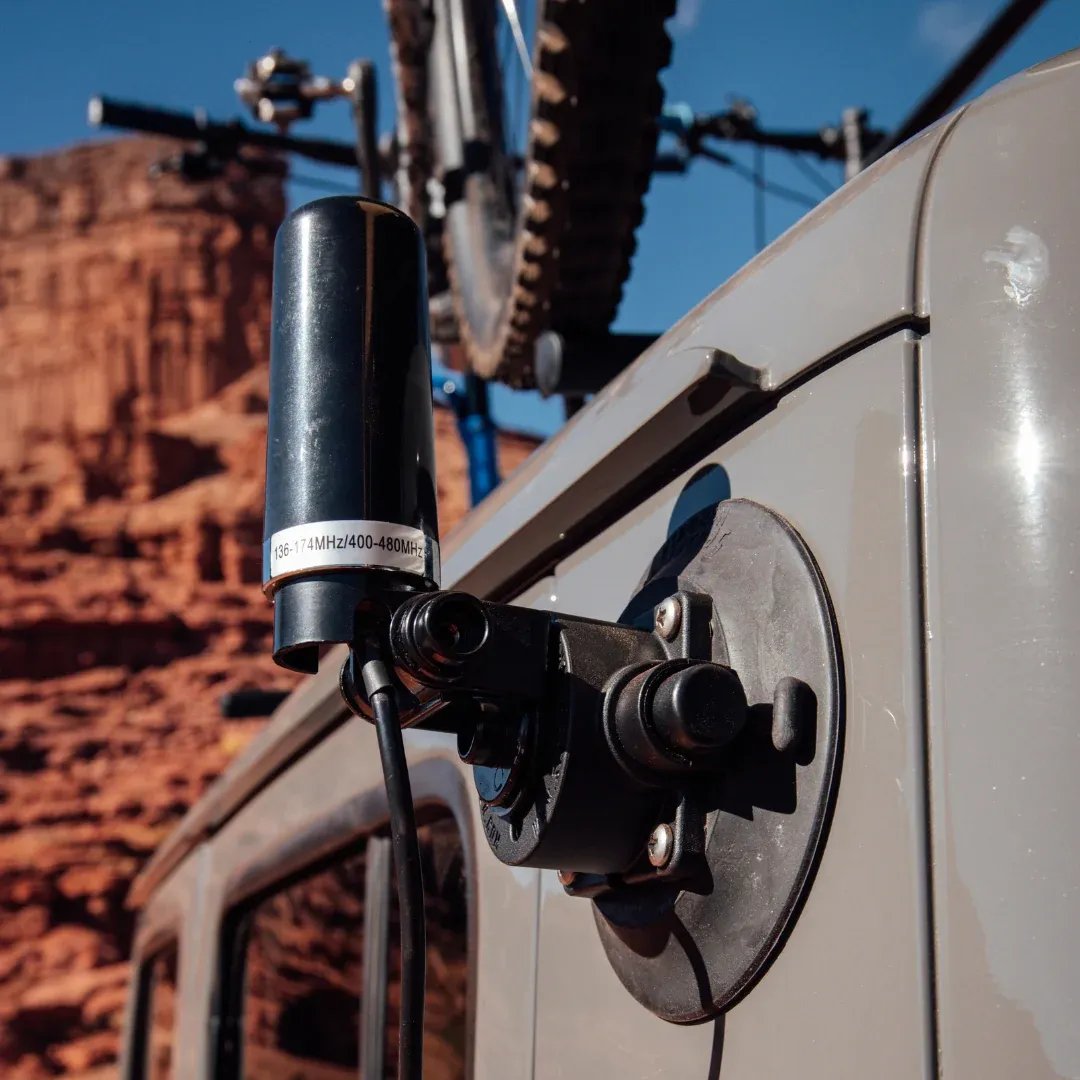 Close-up of removable vacuum antenna mounting base attached to off-road vehicle