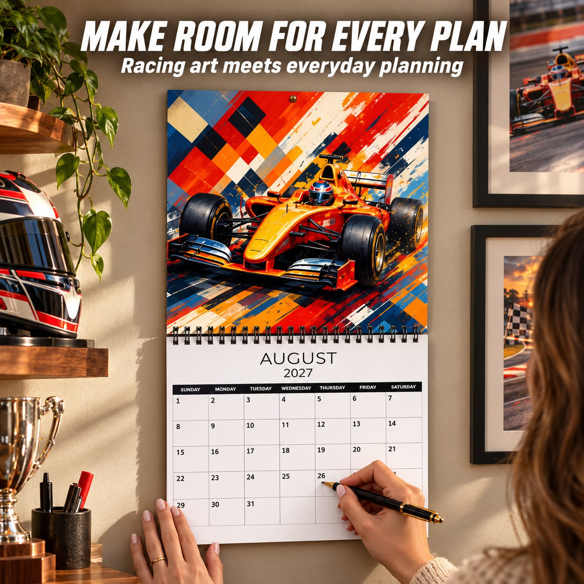 Open August 2027 racing wall calendar with visible monthly date boxes being filled out by hand