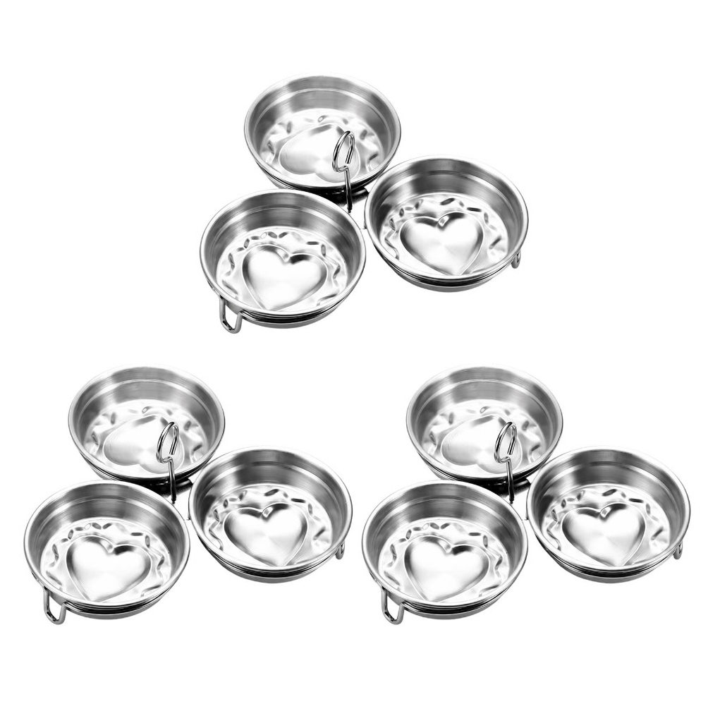 Three heart-design stainless steel egg cooker assemblies