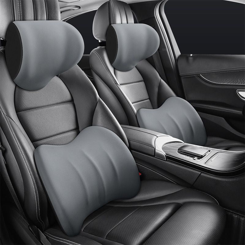 Grey ergonomic headrest and lumbar cushion set installed in car seats